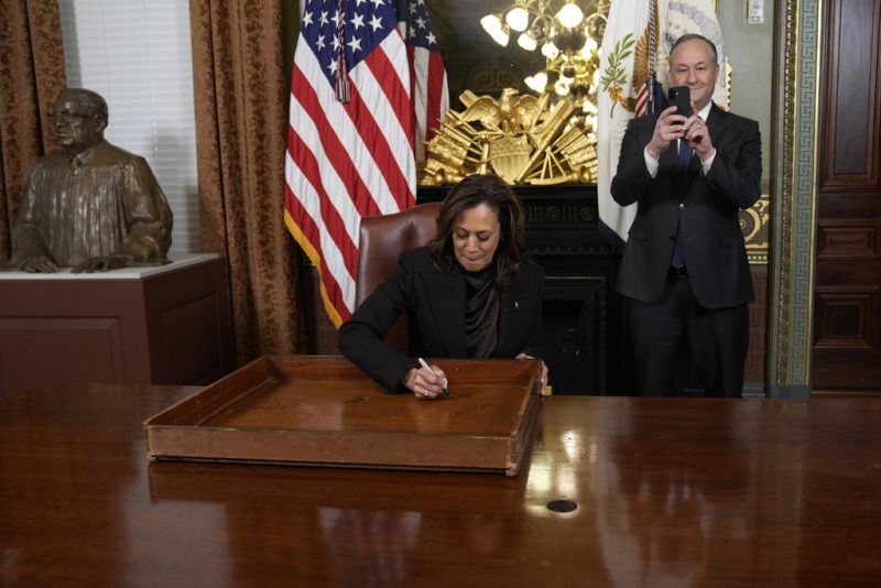 Vice President Harris signs desk as part of long-standing tradition